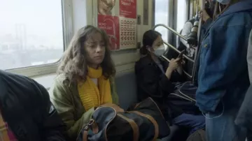 Yellow knit scarf worn by Benita (Julia Mayorga) as seen in Rare Objects