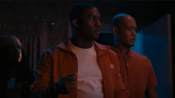 Adidas Originals Red Fire­bird Track Jack­et for Men worn by Kevin Hamilton (Malcolm Mays) as seen in Snowfall (S05E03)