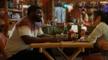 Marine Layer Nicasio Short Sleeve Striped Polo in Sunset Stripe worn by TC (Stephen Hill) as seen in Magnum P.I. (S05E04)