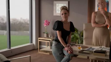 De La Vali 'Koko' Ruffle Trim Puff Sleeve Top In Black worn by Keeley Jones (Juno Temple) as seen in Ted Lasso (S02E12)