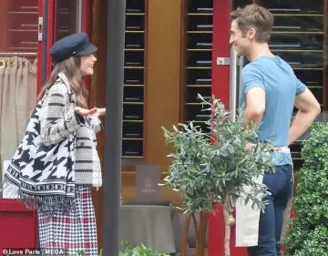 Carolina Herrera Black and white fringe tote bag worn by Lily Collins while filming Emily in Paris Season 3