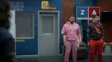 Nike pink hoodie worn by Isaac McAdoo (Kola Bokinni) as seen in Ted Lasso (S03E04)