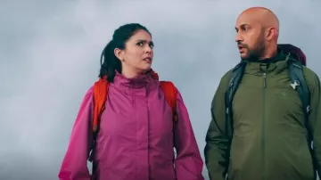 Woods To­ba 2L Hood­ed Rain Jack­et worn by Melissa Gimble (Cecily Strong) as seen in Schmigadoon! (S01E01)