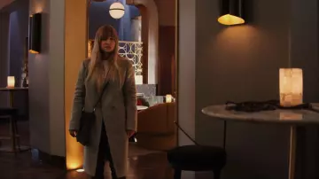 Clare V Army Pablo Cat Suede Foldover Clutch worn by Cassie Bowden (Kaley Cuoco) as seen in The Flight Attendant (S02E07)
