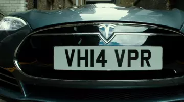 The Tesla Model S with Sacha Baron Cohen and Mark Strong in The Brothers Grimsby