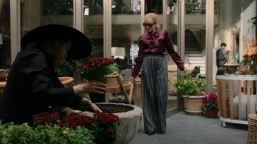 Dolce & Gabbana Tie Neck Stretch Satin Blouse worn by Anna Delvey (Julia Garner) as seen in Inventing Anna (S01E03)