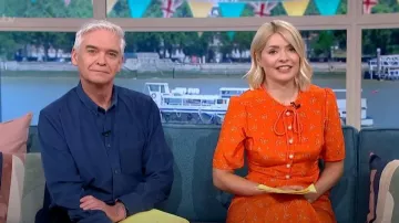 LK Bennett Montana Orange Flower Bow Print Silk Tea Dress worn by Holly Willoughby as seen in This Morning on May 2, 2023
