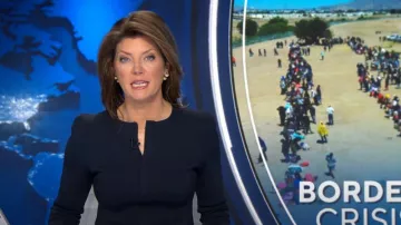 Scanlan Theodore Crepe Knit Ruffle Jacket worn by Norah O'Donnell as seen in CBS Evening News on May 9, 2023