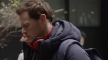 Black puffer jacket worn by Rob Burns (Sam Heughan) in Love Again