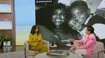 Saint Laurent Hooded Jacket In Crepe Satin worn by Kelly Rowland as seen in Tamron Hall on June 2, 2023