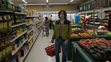 Green and blue zip jacket worn by Danny Sullivan (Tom Holland) as seen in The Crowded Room (S01E02)