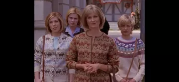 The Eddie Bauer print sweater worn by Janet (Julie Wittner) in the series Gilmore Girls (Season 3 Episode 4)