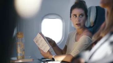 Reasons To Stay Alive book red by Sheena (Liz Kingsman) in Hijack (S01E01)