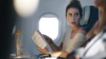 Reasons To Stay Alive book red by Sheena (Liz Kingsman) in Hijack (S01E01)