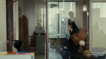 Brown leather tote bag worn by Sylvia (Rose Byrne) as seen in Platonic (S01E07)