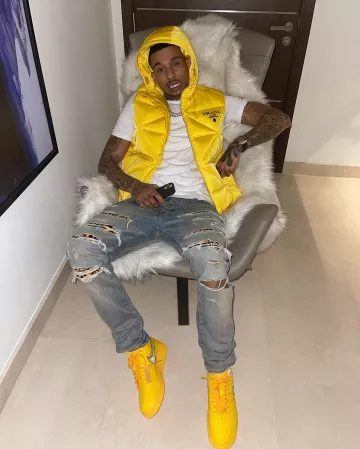 Prada Yellow Triangle Quilted Down Vest in Yellow worn by Fredo on his Instagram account @fredo