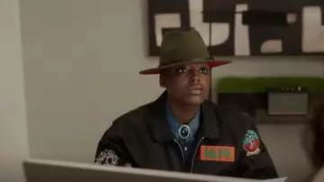 Denim Tears Trans-At­lantic Flight Jack­et worn by Deirdre (Wakeema Hollis) as seen in And Just Like That… (S02E07)