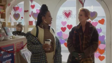 Canada Goose x Reformation printed parka worn by Dr. Nya Wallace (Karen Pittman) in And Just Like That… (Season 2 Episode 7)