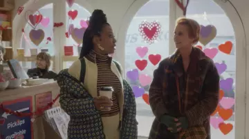 Canada Goose x Reformation printed parka worn by Dr. Nya Wallace (Karen Pittman) in And Just Like That… (Season 2 Episode 7)