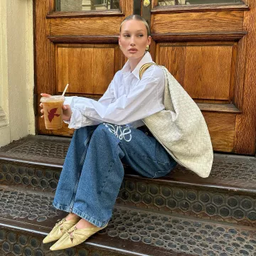 Loewe Anagram High-Rise Wide-Leg Jeans worn by Meredith Duxbury on her Instagram Post on July 28, 2023