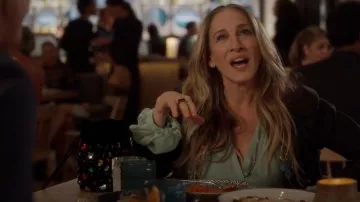 Giuseppe Zanotti Bead­ed Suede Buck­et Bag worn by Carrie Bradshaw (Sarah Jessica Parker) as seen in And Just Like That… (S02E08)