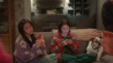 Dolls Kill Pur­ple Flo­ral Knit Cardi­gan worn by Lily Goldenblatt (Cathy Ang) as seen in And Just Like That… (S02E08)