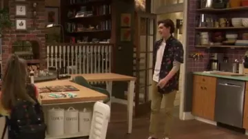 Molokai Surf Wa­ter­mel­ons on Black Shirt worn by Neil (Felix Avitia) as seen in Raven's Home (S06E14)