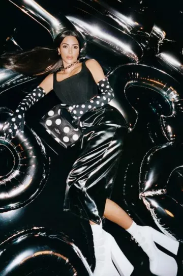 Marc Jacobs The Croc Embossed Kiki Ankle Boot worn by Kim Kardashian in Marc Jacobs Fall 2023 Campaign on August 9, 2023