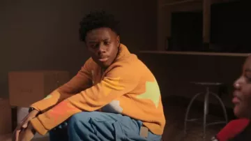 Billionaire Boys Club Shoot­ing Star Cardi­gan worn by Kevin Williams (Alex R. Hibbert) as seen in The Chi (S06E01)