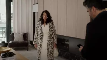 Kallmeyer Opus Trench in Ze­bra worn by Seema Patel (Sarita Choudhury) as seen in And Just Like That… (S02E09)
