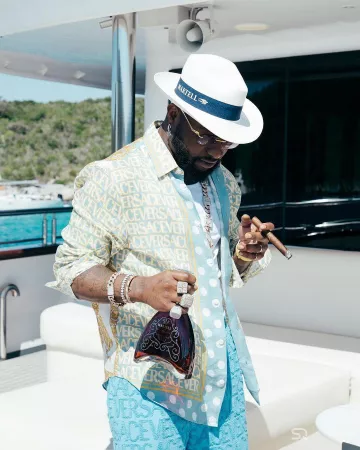 Versace Light Blue & Allover Yellow Logo Linen Shirt worn by Davido on the Instagram account @davido