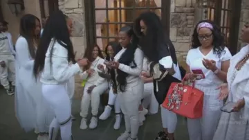 Nike Dri-FIT Swoosh Sports Leggings - White/Gold Stripe worn by Sanya Richards-Ross as seen in The Real Housewives of Atlanta (S15E14)