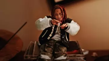 Wales Bonner Navy & White As­cend Var­si­ty Jack­et worn by Trippie Redd in Closed Doors (Music Video) with Roddy Ricch