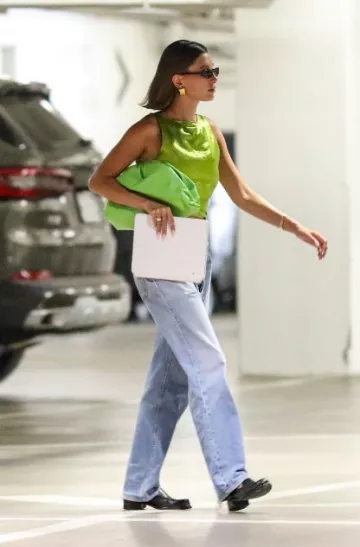 Bottega Veneta Pouch Clutch worn by  Hailey Bieber in Beverly Hills Post on August 14, 2023