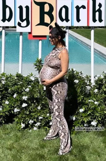 Stella McCartney Python Print Backless Jersey Top worn by Kourtney Kardashian Travis Barker’s on her Instagram Story on September 24, 2023