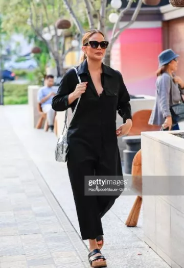 Givenchy Black 4G Sun­glass­es worn by Chrissy Teigen in Los Angeles post on August 1, 2023