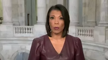 Ann Taylor Faux Leather Puff Sleeve Peplum Top worn by Nikole Killion as seen in CBS Saturday Morning on October 6, 2023
