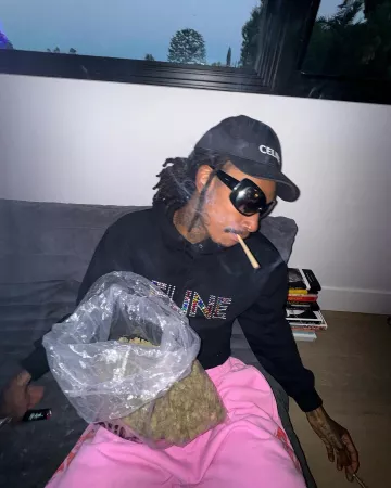 Balenciaga Pink Side Logo Baggy Sweatpants worn by Wiz Khalifa on the Instagram account @wizkhalifa