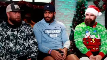 Peanuts Snoopy Chillin Christmas Sweater with Long Sleeves worn by Jason Kelce as seen in Today on October 23, 2023