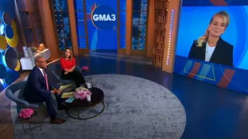 Elie Tahari Puff Sleeve Sweater in Summer Coral worn by Eva Pilgrim as seen in Good Morning America on October 25, 2023