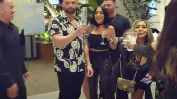 Gucci GG Marmont Small Shoulder Bag worn by Nicole Polizzi as seen in Jersey Shore: Family Vacation (S06E30)