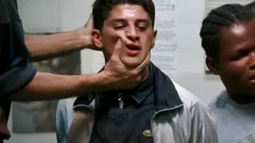 The navy blue Lacoste polo shirt worn by Saïd (Saïd Taghmaoui) in the movie La Haine