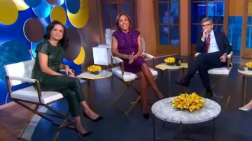 Ann Taylor Faux Leather Seamed Split Neck Peplum Top In Boxwood Green worn by Linsey Davis as seen in Good Morning America on  November 6, 2023