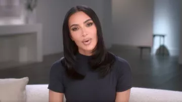 Skims Short Sleeve Mock Neck Tee worn by Kim Kardashian as seen in The Kardashians (S04E07)