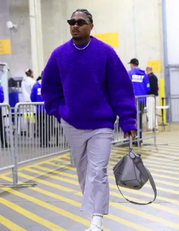 Jil Sander Pur­ple Tex­tured Over­sized Sweater worn by Stefon Diggs on the Instagram account @stefondiggs
