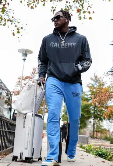 Gallery Dept. Roy­al Blue Paint­ed Flared Sweat­pants worn by A. J. Brown on the Instagram account @a.j.brown_