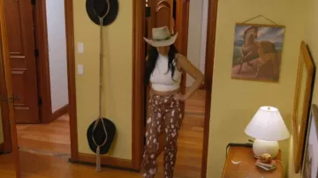 Rotate Birger Christensen Robyn printed Faux Leather Straight-leg Pants worn by Danielle D'olivera as seen in Winter House (S03E02)