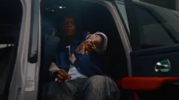 Amiri Vintage Indigo Allover Logo Cargo Jeans worn by YTB Fatt in YTB Fatt- She Legit (Official Video)