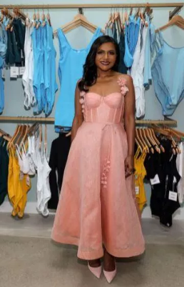 Zimmermann Won­der­land Mi­di Corset Dress worn by Mindy Kaling at Mindy X Andie Collection Launch post on June 7, 2023