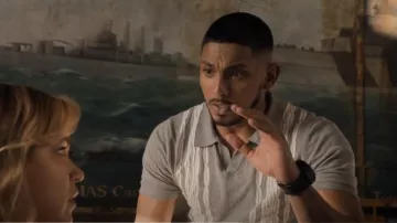 Oxford Finni­gan Knit­ted Po­lo worn by NCIS Special Agent DeShawn Jackson (Sean Sagar) as seen in NCIS: Sydney (S01E02)